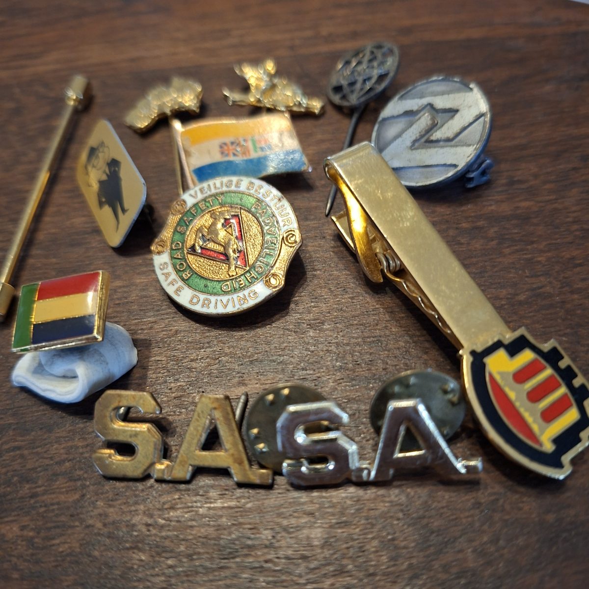 Various pins, enamel, Old SA flag,  SA metal pins. Road safety, and others