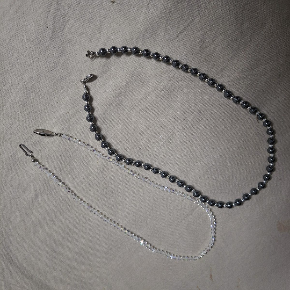 1 Crystal glass and 1 Hematite necklace - 41 and 45 cms,