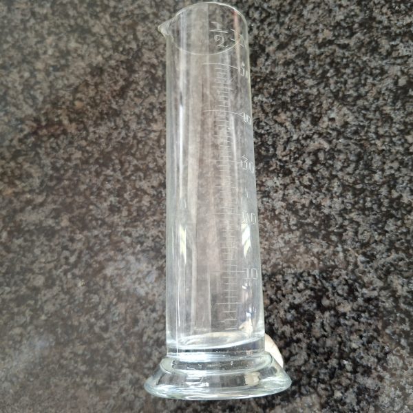 Scientific measuring glass for rain liquids.  In inches.   18 cms tall.