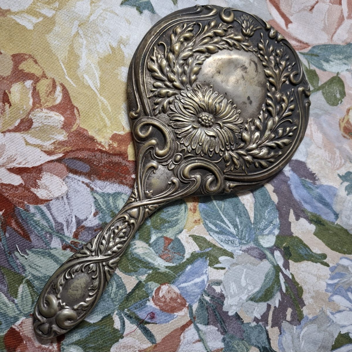 Epns Hand Mirror Victorian? Nouveau? Embossed.  Good bevelled mirror.