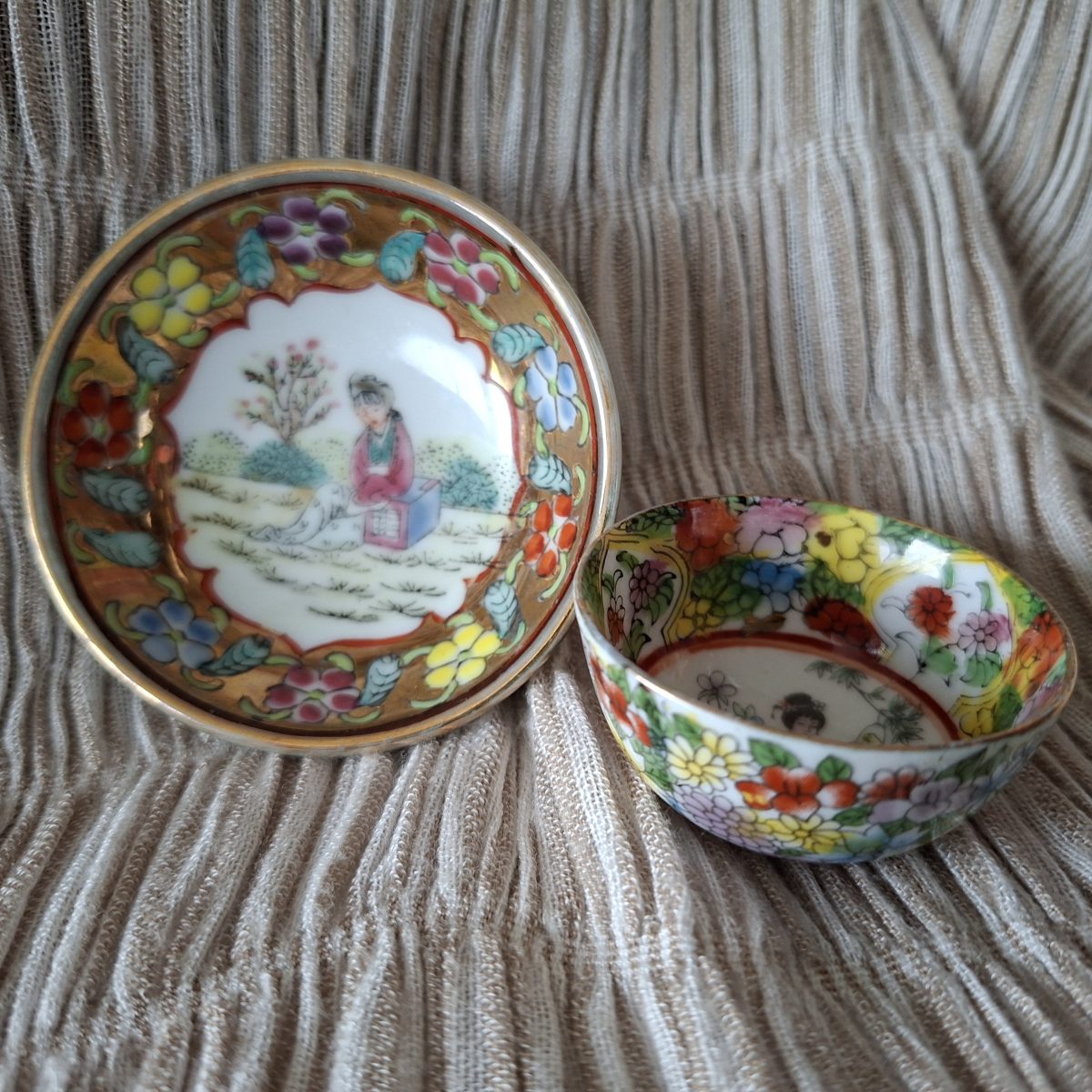 Oriental miniature tea bowl / sake bowl and small bowl.  Very pretty gilded floral and figurative designs