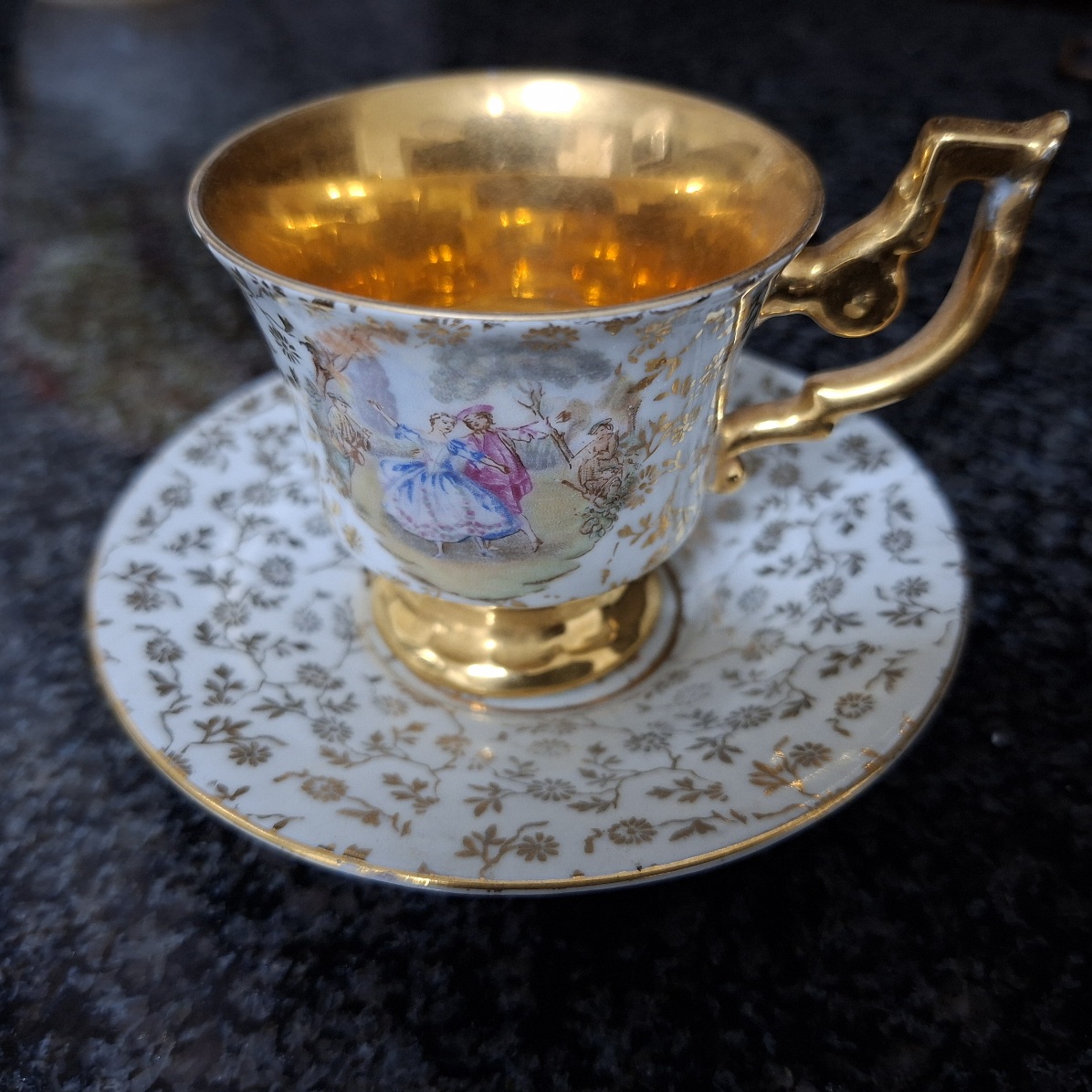Gilded small cup and saucer PP Imperial porcelain  -  Romantic images.