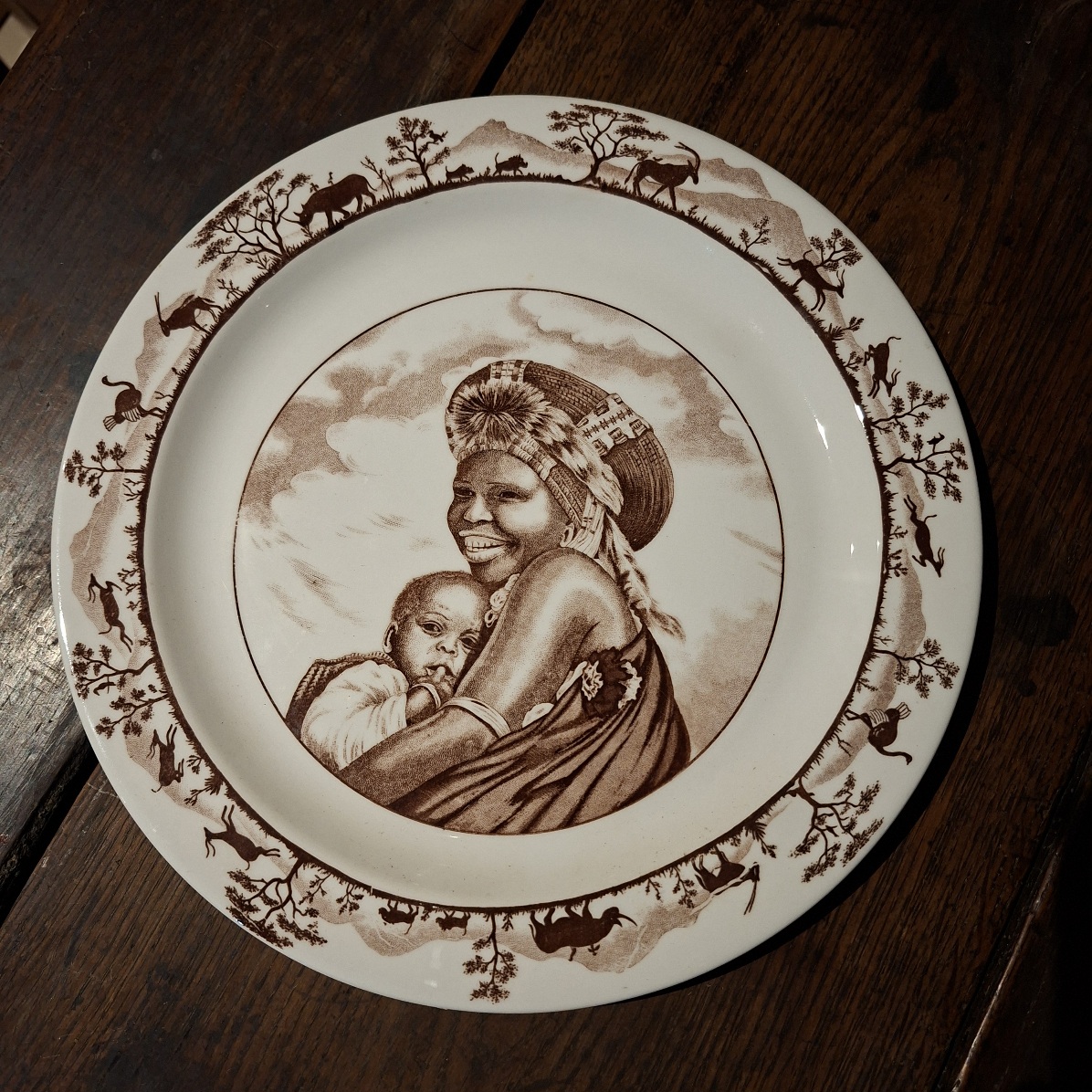 2 large "South Africa handcraft" Plates.   1 with Zulu woman 1 with Bushman San people images. 26.5 cms