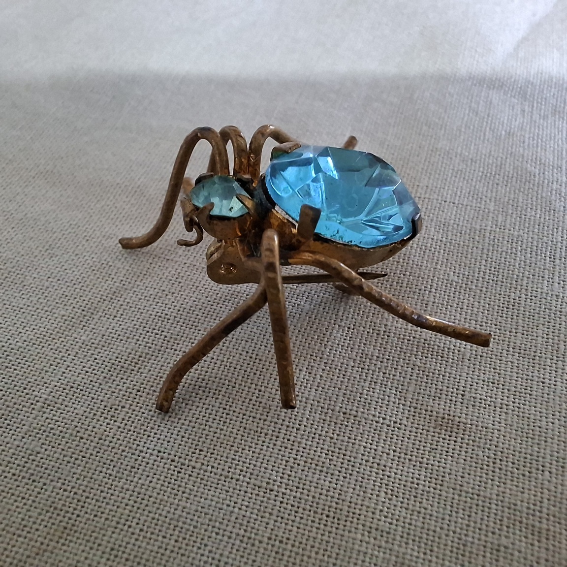 Spider brooch - faceted blue glass and gilt metal