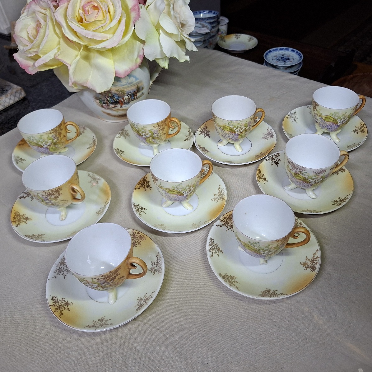 8 coffee duos - fine porcelain duos on three legs.  Embossed leaves and flowers.