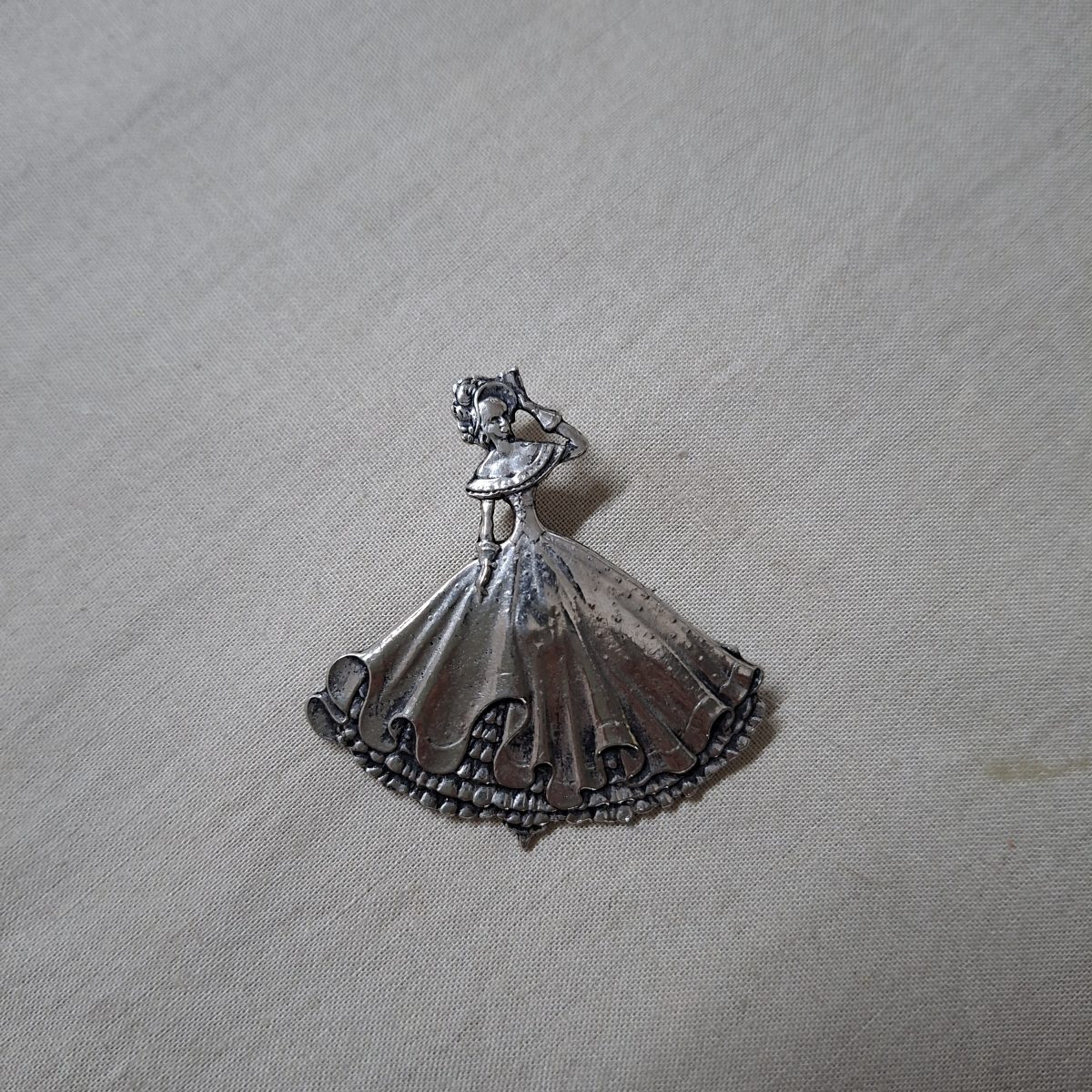 Vintage pressed metal brooch - Victorian Crinoline lady
