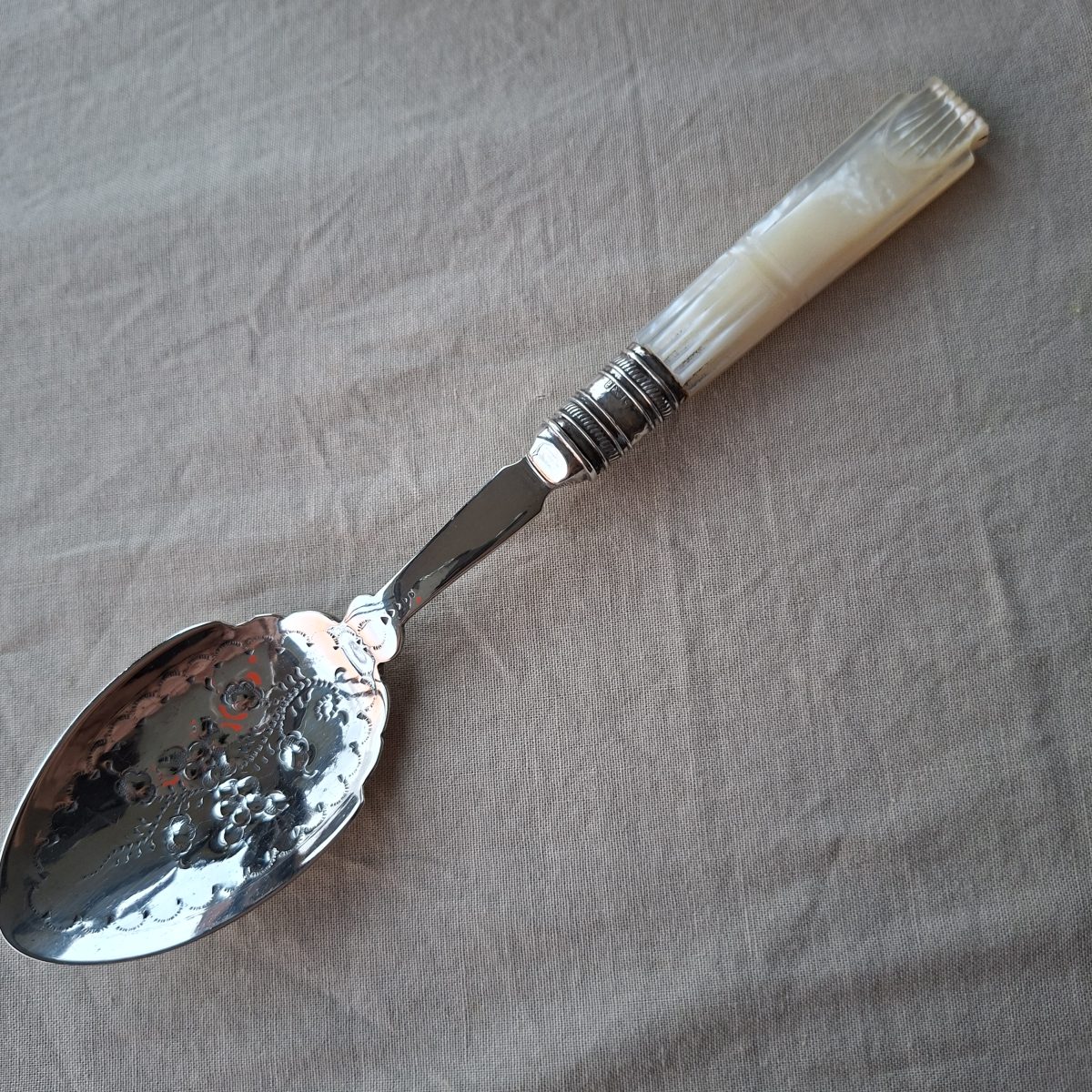 Hallmarked collar SP spoon with Mother of Pearl handle