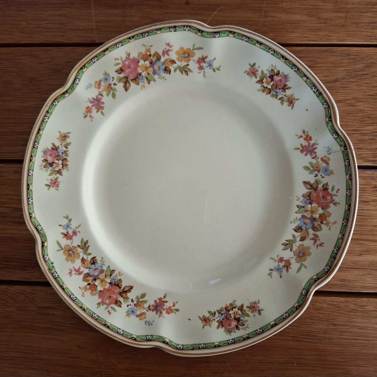 Cream Plate with floral design.  Tea Plate Johnson Bros England