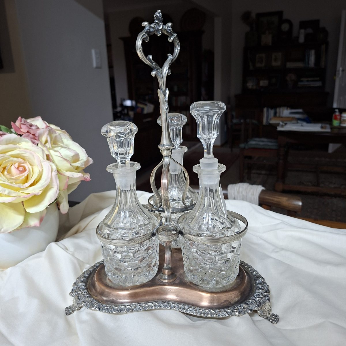 Large Silver plate Tantalus - cruet set.  3 Crystal bottles  - SP on Copper.  35 cms tall x 25cm base
