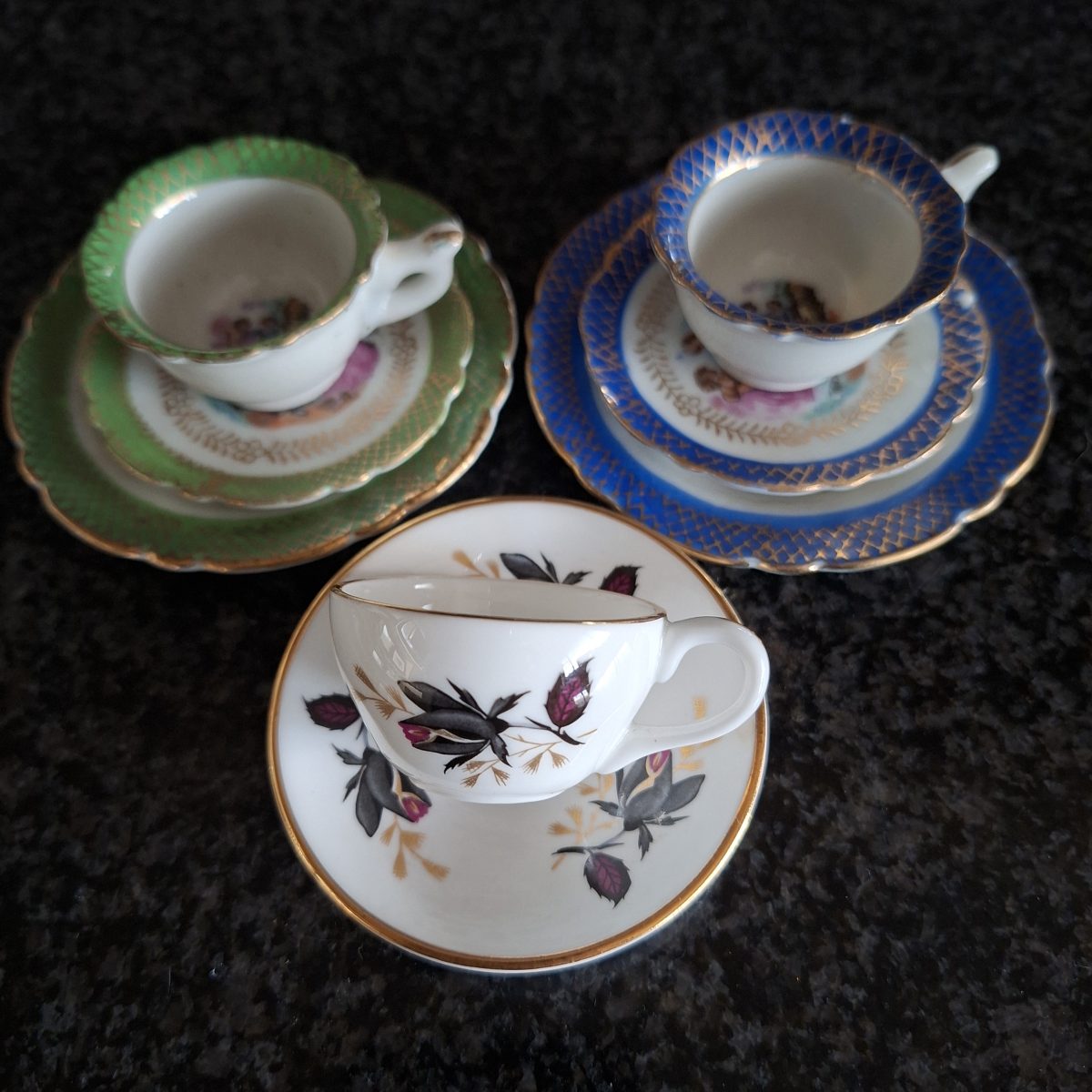 mini tea cup trios and 1 duo Tea cup