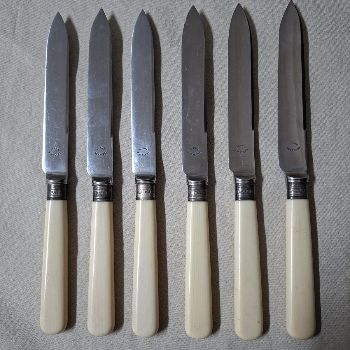 6 bone handled fruit knives with hallmarked silver collars