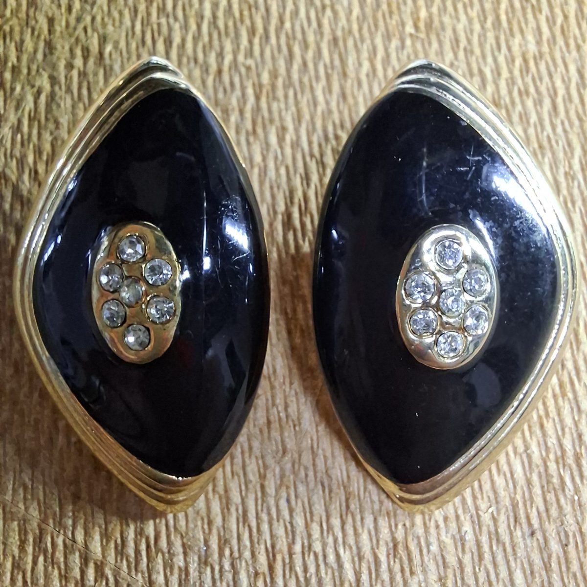 Vintage black and gold clip on earings with rhinestones.   Clip on. L and X Stamps