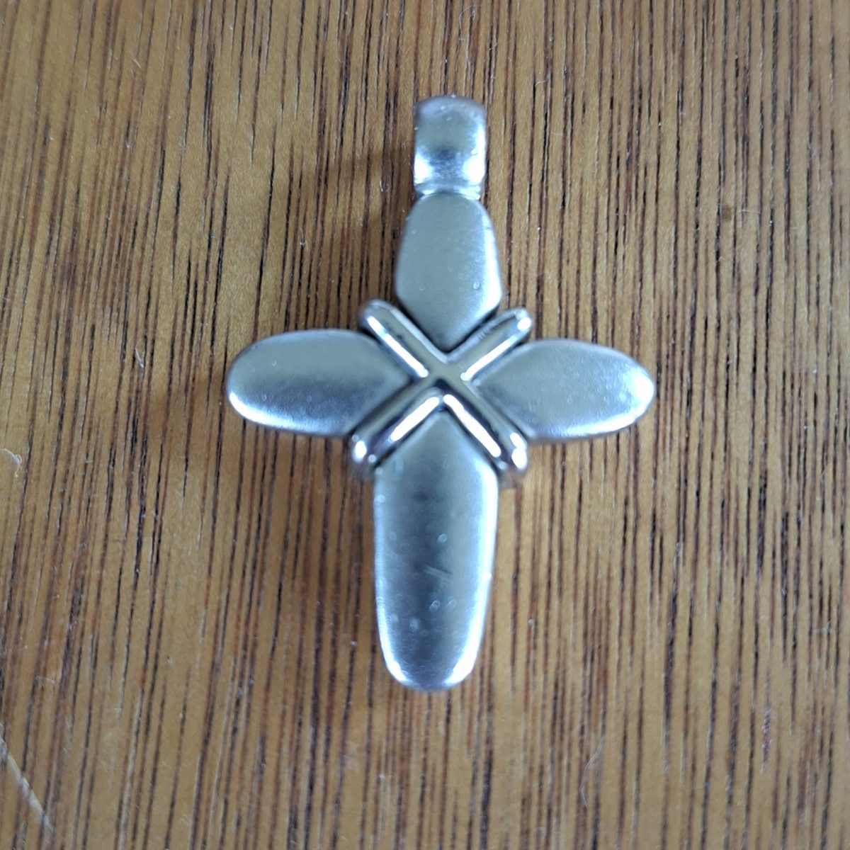 Silver tone cross pendant