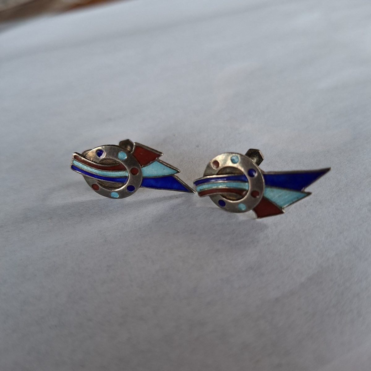 Silver earings with enamel deco type designs - screw on.