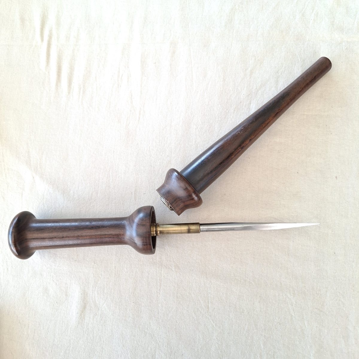 Steel rondel Dagger in turned wooden clip close dark wood sheath. Self protection.
