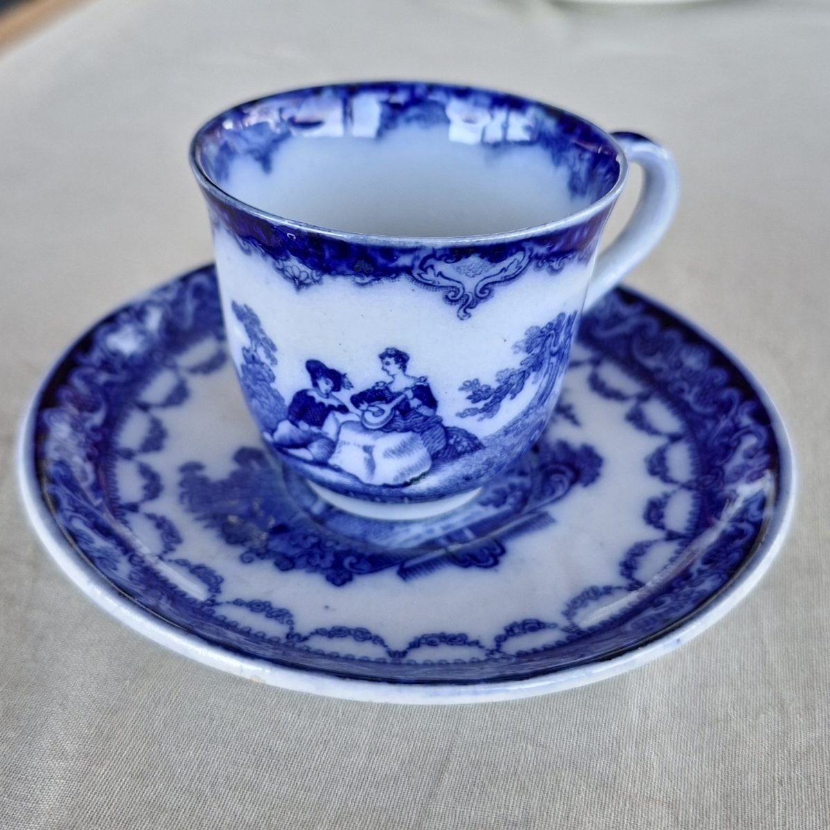 Antique coffee cup duo Doulton Watteau pattern - flow blue romantic scene