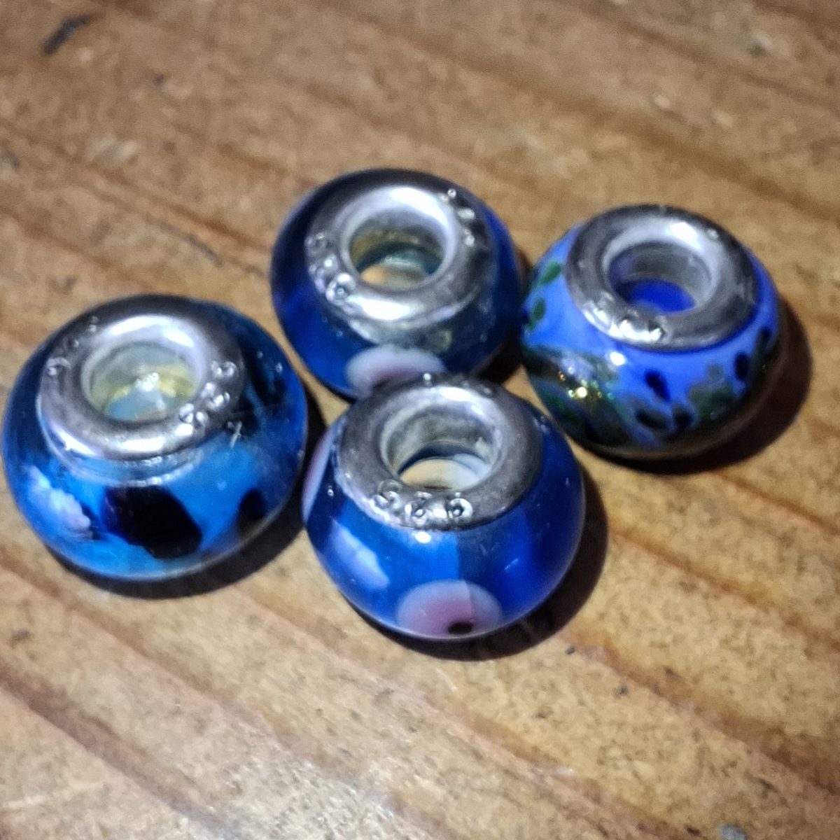 4 glass beads Murano? with 925 silver insets.