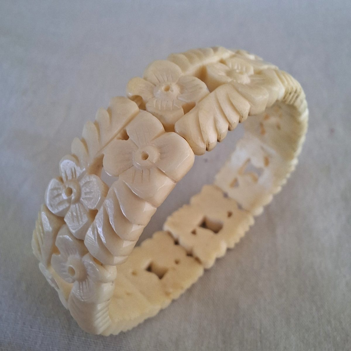 Carved cream coloured floral bangle, bracelet - bone?