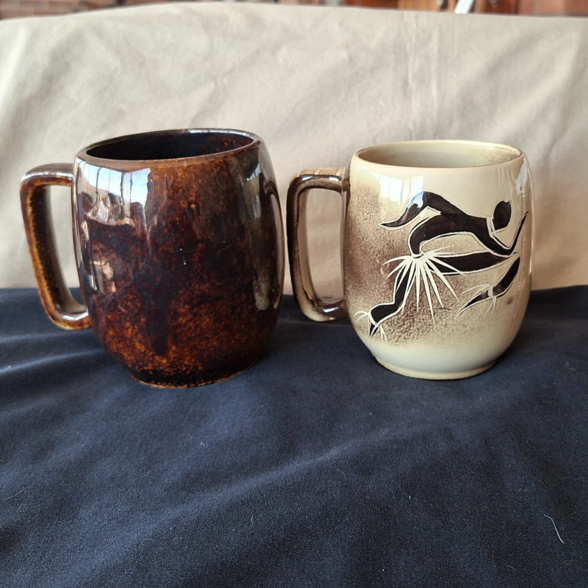 Two SA made Ceramic mugs 1 crescent potteries and Kruger park Souvenir ware