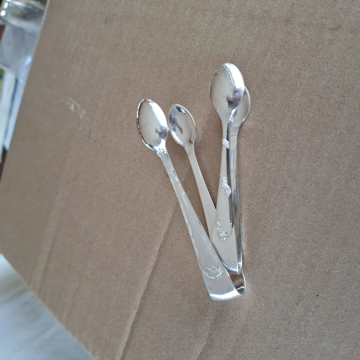 2 silver plate sugar tongs vintage