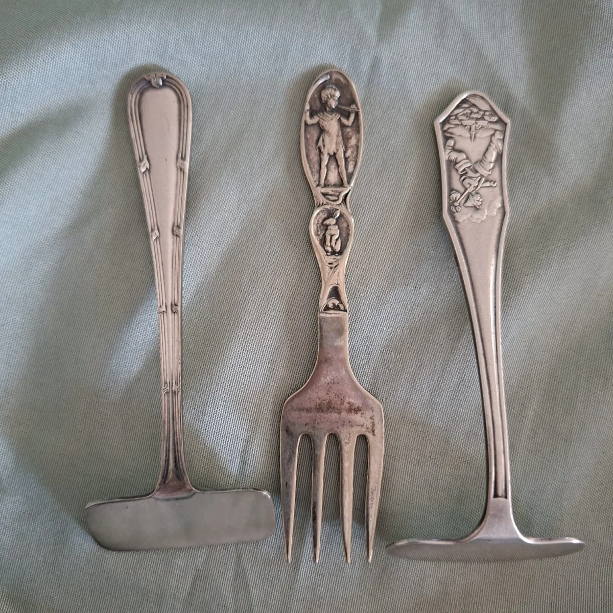 Childs feeding utensils, fork and 2 pushers - nursery rhyme characters