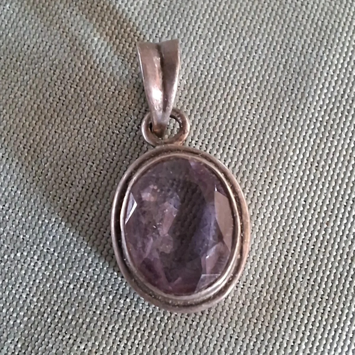 Silver pendant with pale purple stone