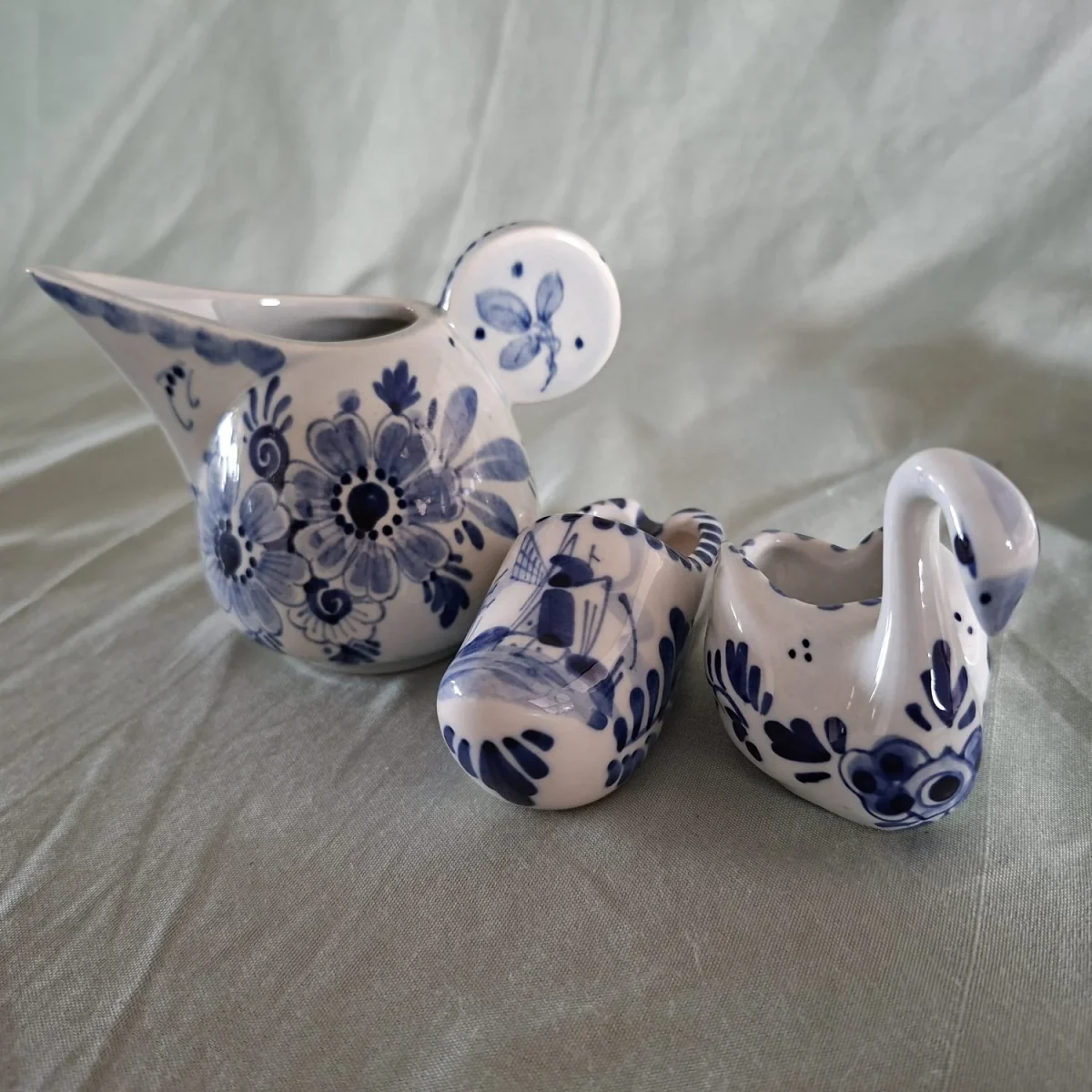 3 Delfts blue and white mini items, Jug and clog signed plus a swan