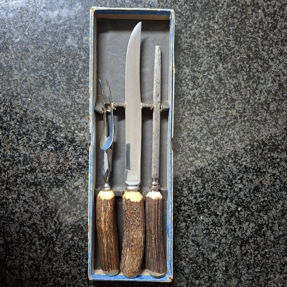 Vintage carving set - horn handles, stainless steel blade and fork. Forged steel sharpener.