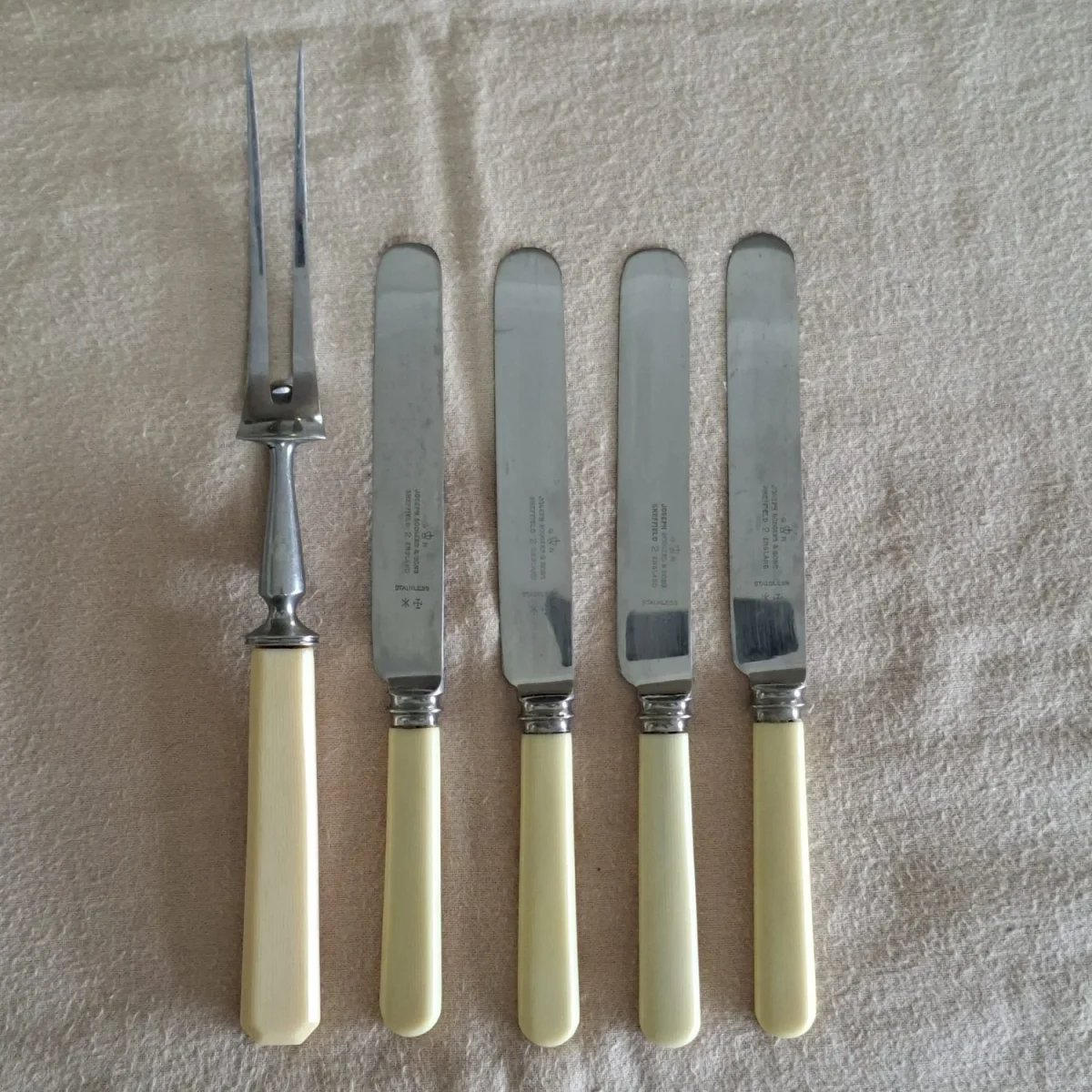 4 Joseph Rodgers table knives and 1 carving fork.   Good condition