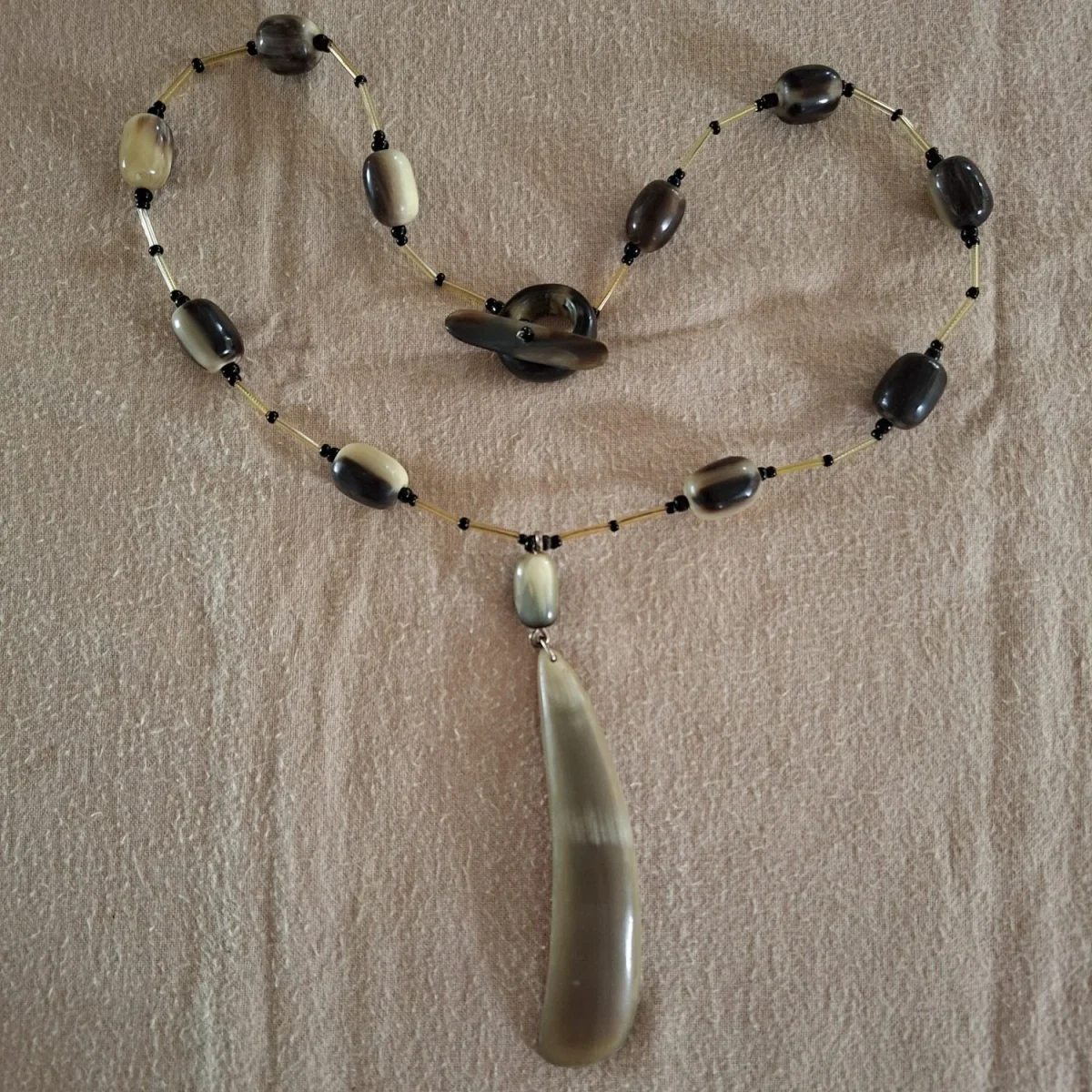 Buffalo or bull horn necklace.  Toggle closure
