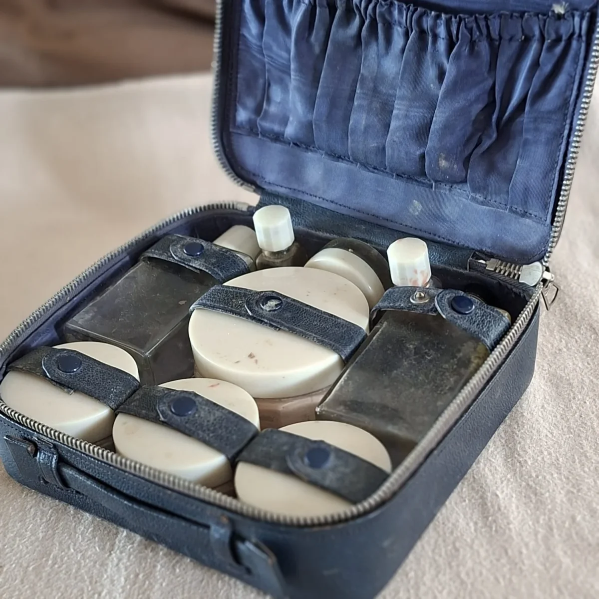 Leather travel or vanity case.  Toilette set - Blue Leather, glass powder jars and bottles